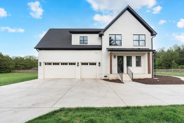 modern farmhouse with fence, concrete driveway, a garage, and a front yard