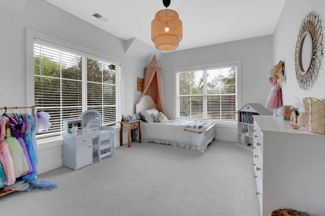 bedroom with visible vents and carpet flooring