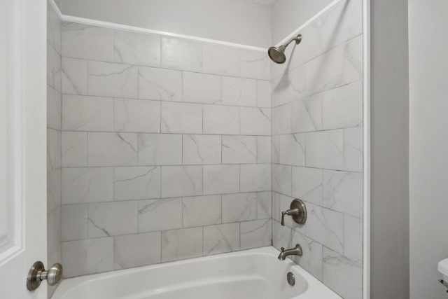 full bath featuring shower / bath combination and toilet