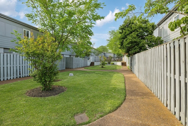 view of yard with a fenced backyard
