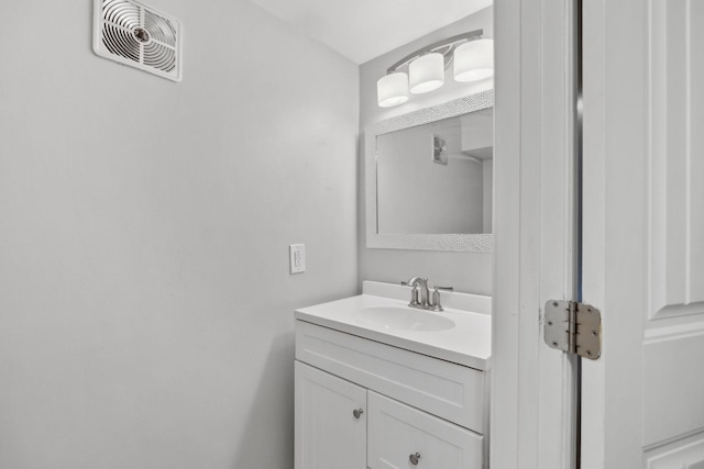 bathroom with visible vents and vanity