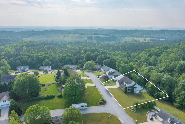 aerial view with a wooded view