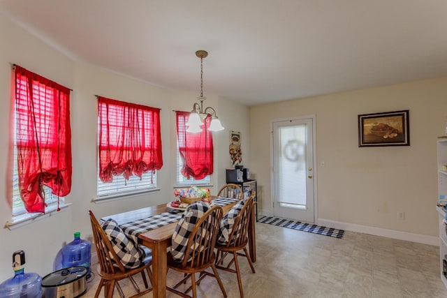dining area with tile patterned floors and baseboards