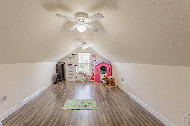 game room with baseboards, ceiling fan, wood finished floors, and lofted ceiling