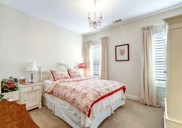 5028 Rockport Ave, Franklin, TN 37064 - bedroom featuring light colored carpet, a notable chandelier, visible vents, and baseboards