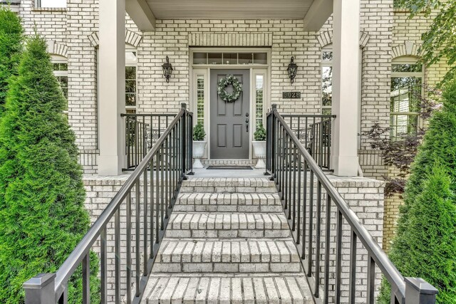 5028 Rockport Ave, Franklin, TN 37064 - property entrance featuring a porch and brick siding
