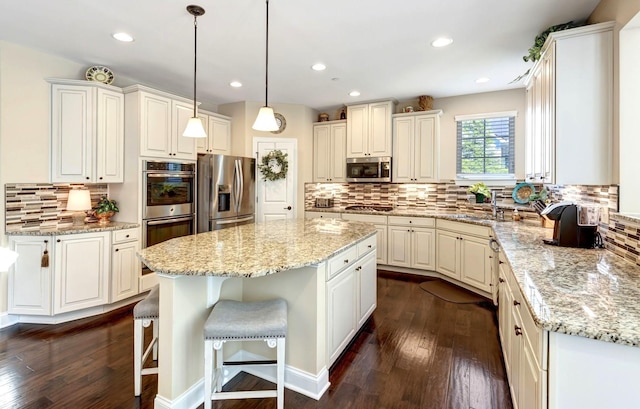 5028 Rockport Ave, Franklin, TN 37064 - kitchen featuring dark wood-type flooring, tasteful backsplash, and stainless steel appliances