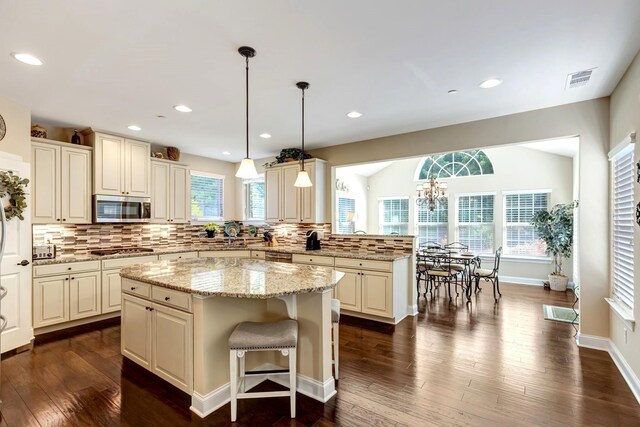5028 Rockport Ave, Franklin, TN 37064 - kitchen featuring visible vents, dark wood-style flooring, a center island, appliances with stainless steel finishes, and backsplash