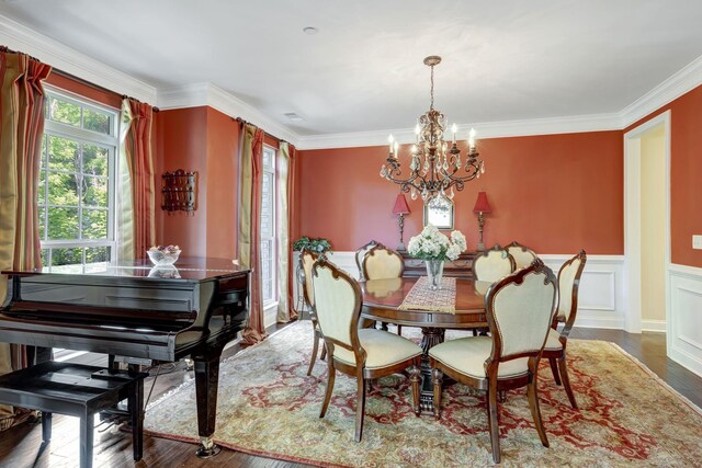 5028 Rockport Ave, Franklin, TN 37064 - dining area with ornamental molding, wainscoting, wood finished floors, and a notable chandelier