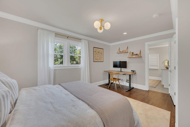 bedroom with baseboards, a notable chandelier, ornamental molding, and wood finished floors