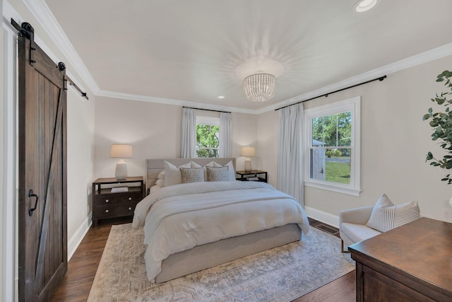 bedroom with baseboards, ornamental molding, dark wood-style floors, and a barn door