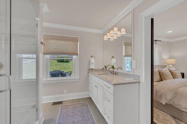 ensuite bathroom featuring crown molding, vanity, baseboards, ensuite bathroom, and visible vents
