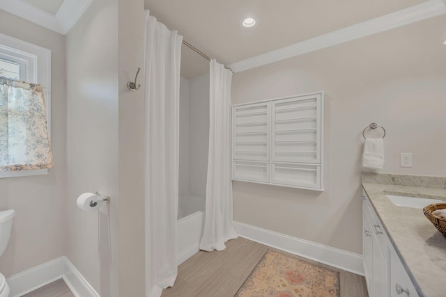 bathroom featuring vanity, shower / bath combination with curtain, recessed lighting, baseboards, and wood finished floors