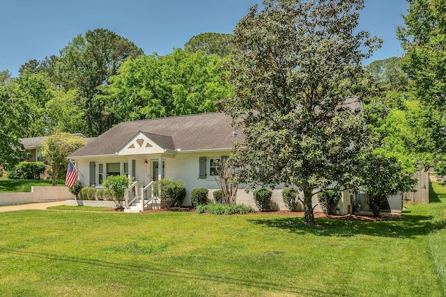 ranch-style house with a front lawn