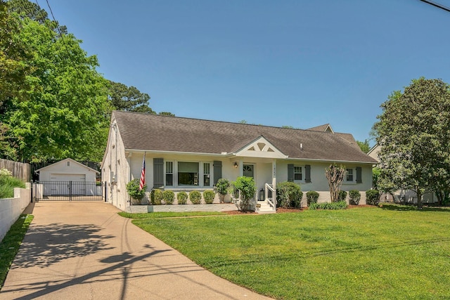 view of front of property featuring fence, a shingled roof, a front lawn, a garage, and an outbuilding