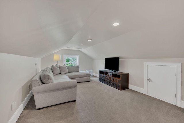 carpeted living room featuring baseboards, lofted ceiling, and visible vents
