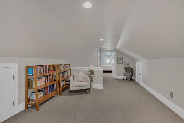 living area with visible vents, vaulted ceiling, baseboards, carpet, and recessed lighting