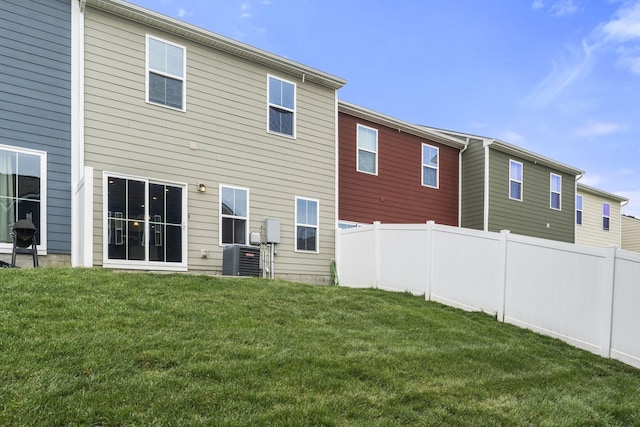 258 Dartmoor Pl, Goodlettsville, TN 37072 - back of house featuring a lawn, fence, and cooling unit