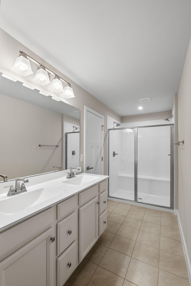 258 Dartmoor Pl, Goodlettsville, TN 37072 - full bath with double vanity, tile patterned floors, a sink, and a stall shower