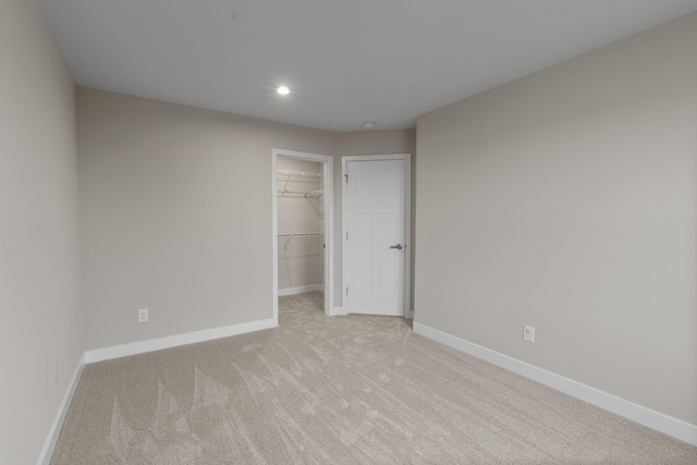 258 Dartmoor Pl, Goodlettsville, TN 37072 - unfurnished bedroom with a closet, baseboards, a walk in closet, light colored carpet, and recessed lighting
