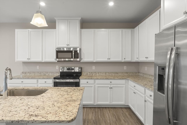 258 Dartmoor Pl, Goodlettsville, TN 37072 - kitchen with a sink, white cabinetry, wood finished floors, and stainless steel appliances