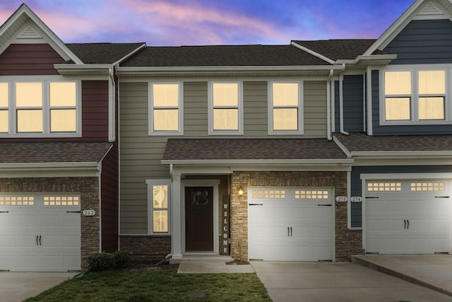 258 Dartmoor Pl, Goodlettsville, TN 37072 - multi unit property with concrete driveway, stone siding, an attached garage, and roof with shingles