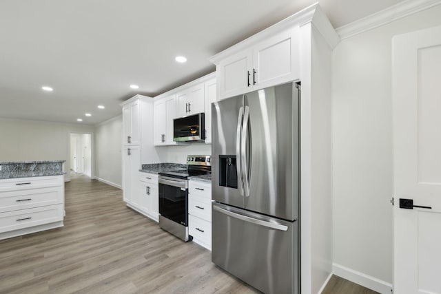 208 Linger Ln, Lebanon, TN 37087 - kitchen featuring appliances with stainless steel finishes, baseboards, white cabinetry, ornamental molding, and light wood-style flooring