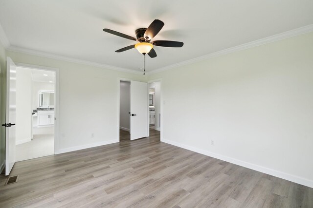 208 Linger Ln, Lebanon, TN 37087 - unfurnished bedroom with light wood-style flooring, a spacious closet, ornamental molding, ensuite bathroom, and baseboards