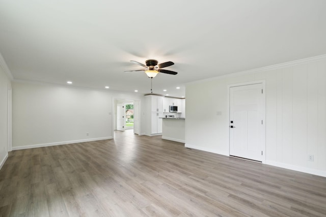 208 Linger Ln, Lebanon, TN 37087 - unfurnished living room featuring a ceiling fan, recessed lighting, light wood-style floors, baseboards, and ornamental molding