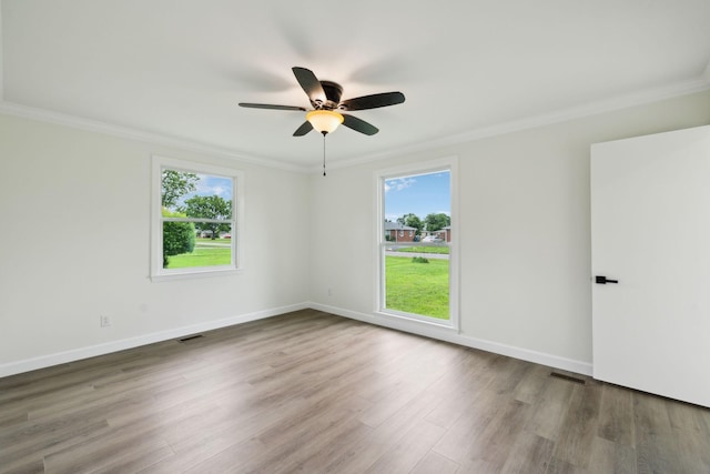 208 Linger Ln, Lebanon, TN 37087 - empty room featuring ornamental molding, plenty of natural light, a ceiling fan, wood finished floors, and baseboards