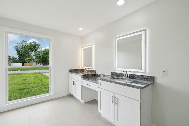 208 Linger Ln, Lebanon, TN 37087 - bathroom with vanity, baseboards, and recessed lighting