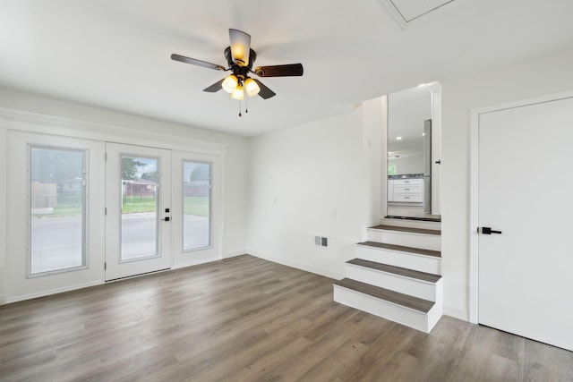 208 Linger Ln, Lebanon, TN 37087 - unfurnished living room featuring wood finished floors, a ceiling fan, french doors, baseboards, and attic access