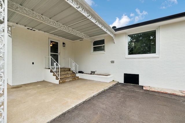 208 Linger Ln, Lebanon, TN 37087 - doorway to property with brick siding and a patio area