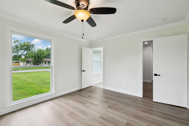 208 Linger Ln, Lebanon, TN 37087 - unfurnished bedroom with wood finished floors, crown molding, baseboards, and ceiling fan