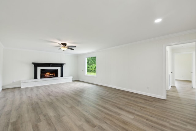 208 Linger Ln, Lebanon, TN 37087 - unfurnished living room with ornamental molding, ceiling fan, wood finished floors, a fireplace, and baseboards