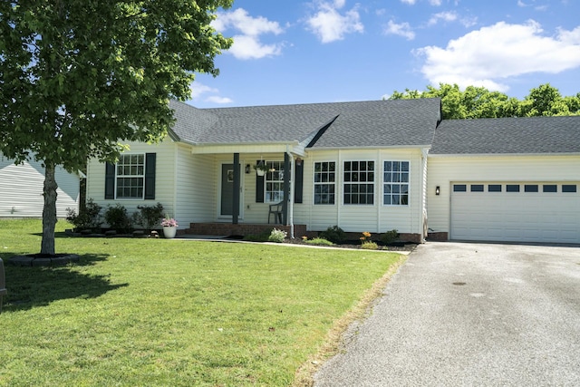 6241 Eskew Dr, Columbia, TN 38401 - ranch-style home with asphalt driveway, a front yard, a shingled roof, and a garage