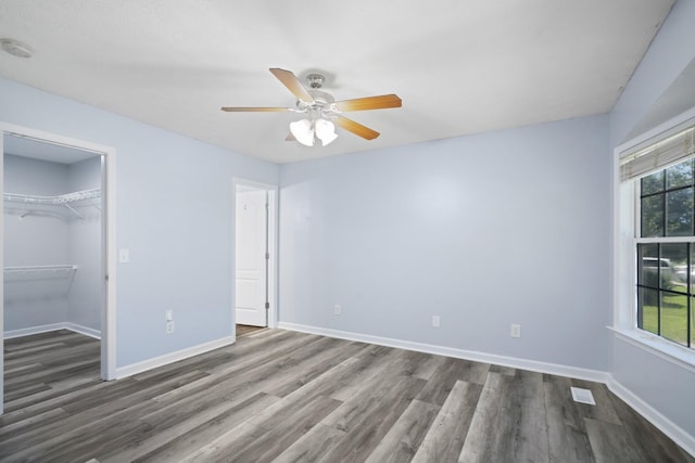 6241 Eskew Dr, Columbia, TN 38401 - unfurnished bedroom featuring dark wood-style floors, baseboards, and a closet