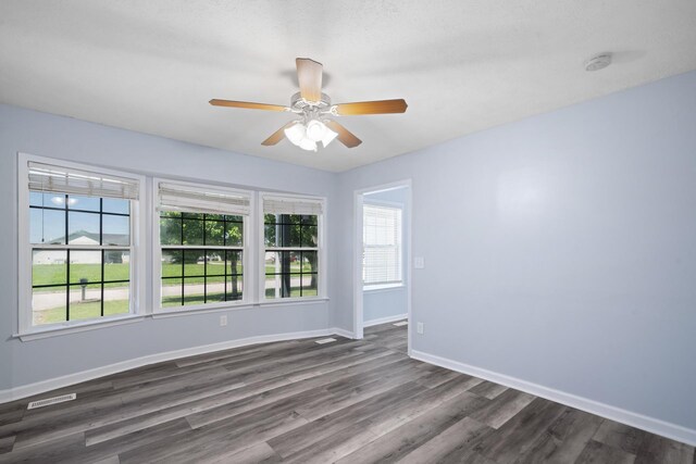 6241 Eskew Dr, Columbia, TN 38401 - empty room with dark wood-style floors, baseboards, and a ceiling fan