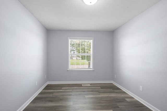 6241 Eskew Dr, Columbia, TN 38401 - empty room with dark wood-type flooring and baseboards