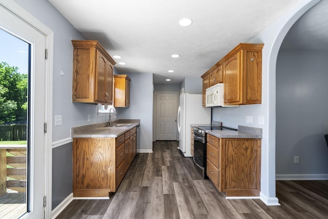 6241 Eskew Dr, Columbia, TN 38401 - kitchen with a sink, white appliances, recessed lighting, and brown cabinets