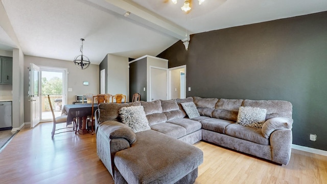 340 Jackson Rd, Clarksville, TN 37042 - living room featuring baseboards, lofted ceiling with beams, light wood-style flooring, and ceiling fan with notable chandelier