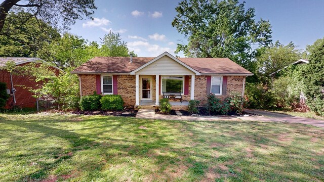 340 Jackson Rd, Clarksville, TN 37042 - single story home with covered porch, brick siding, and a front yard