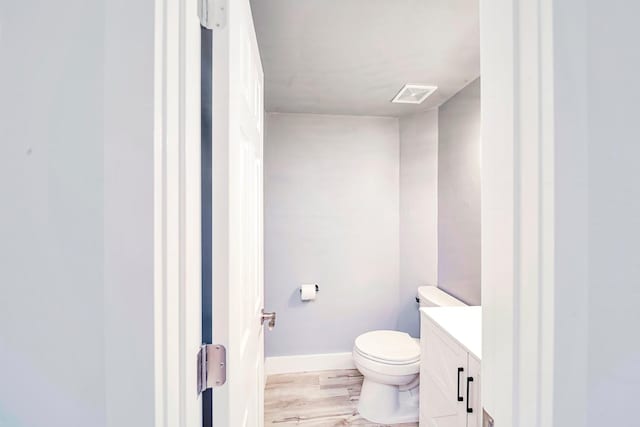210 NW Clearview Dr, Mount Juliet, TN 37122 - half bath with toilet, wood finished floors, visible vents, baseboards, and vanity