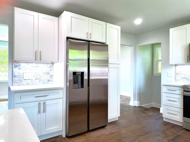 210 NW Clearview Dr, Mount Juliet, TN 37122 - kitchen with stainless steel appliances, light countertops, decorative backsplash, and white cabinetry