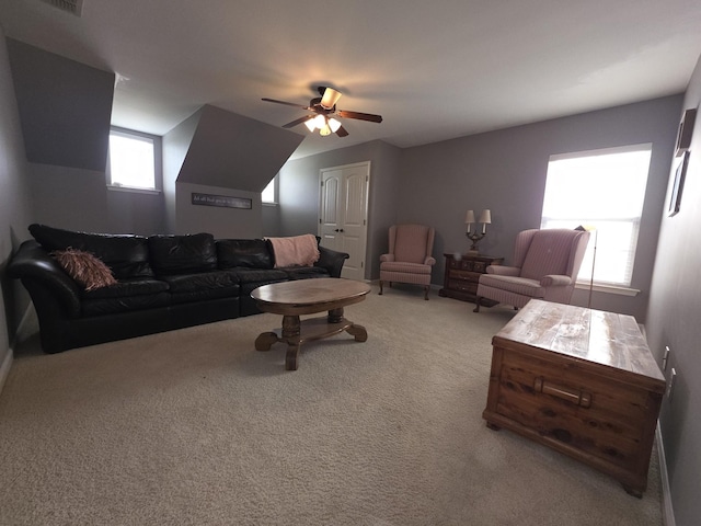 living room with carpet and a ceiling fan
