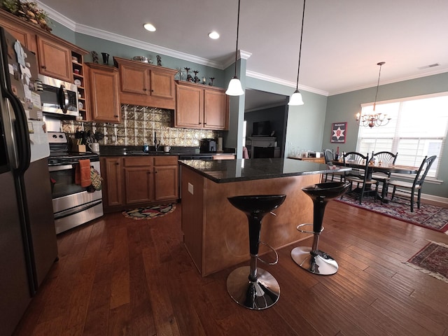 kitchen featuring a kitchen island, visible vents, appliances with stainless steel finishes, open shelves, and brown cabinets