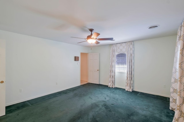 107 Leslie Ln, Hohenwald, TN 38462 - unfurnished room featuring ceiling fan, visible vents, baseboards, and dark colored carpet