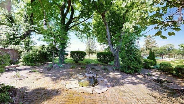 view of patio with an outdoor fire pit