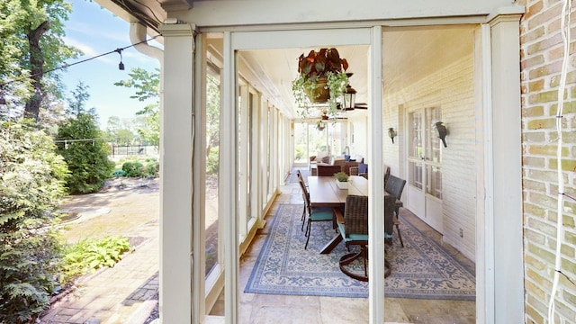 sunroom / solarium with brick wall
