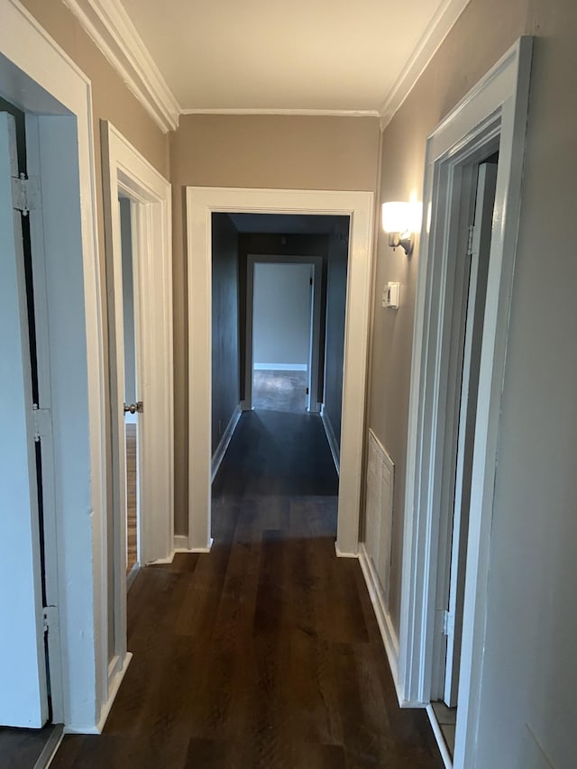 11495 Guthrie Rd, Guthrie, KY 42234 - corridor with crown molding, baseboards, wood finished floors, and visible vents